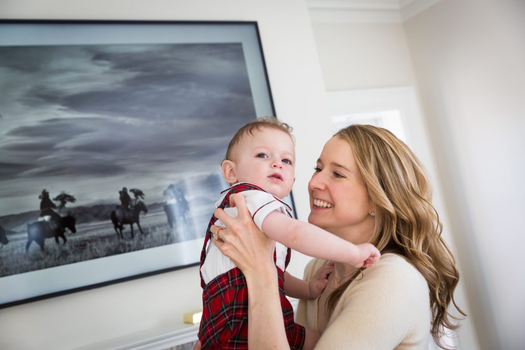 Mother holding baby boy for an article on holiday family portrait ideas