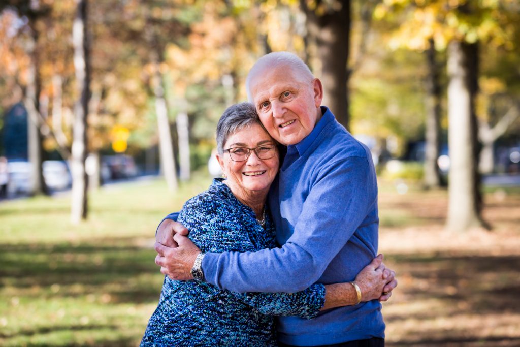 Older couple hugging during a Juniper Valley Park family portrait session