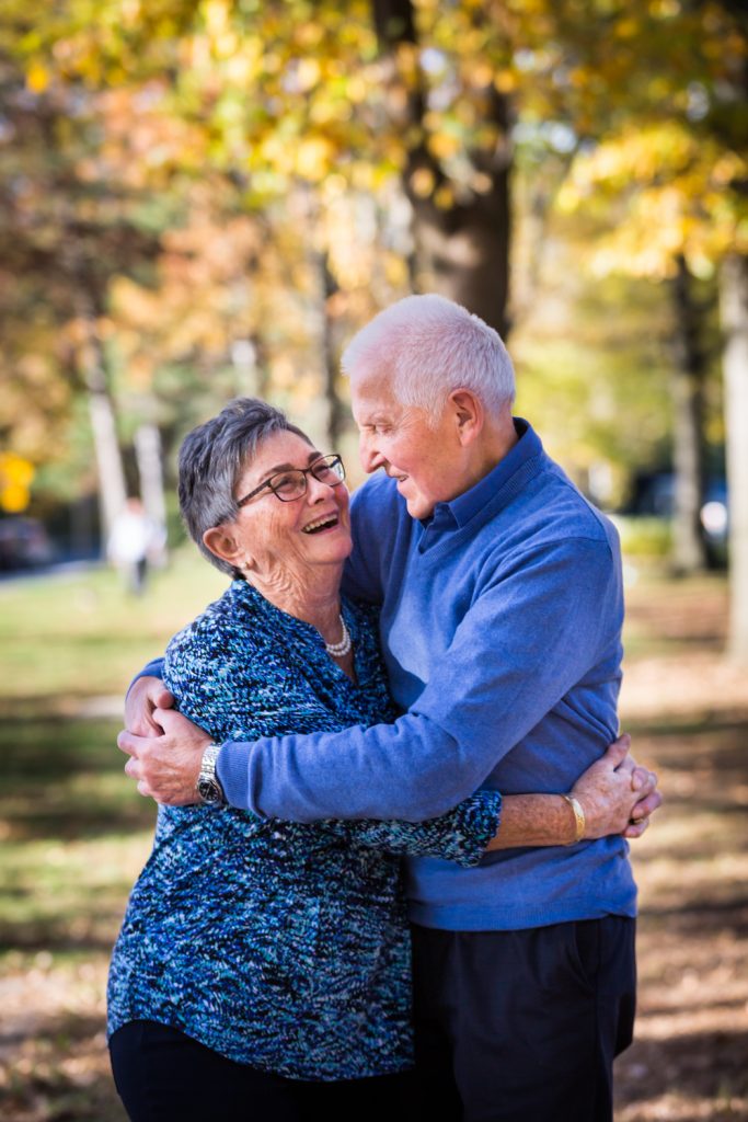 Older couple hugging during a Juniper Valley Park family portrait session