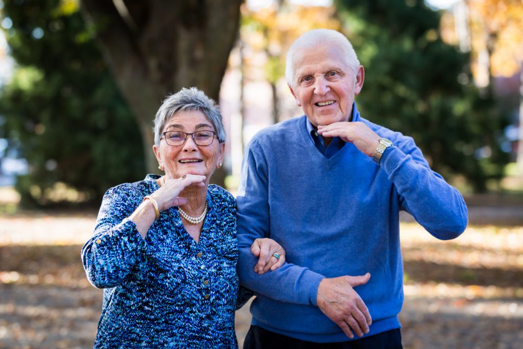 Older couple with hands under chins