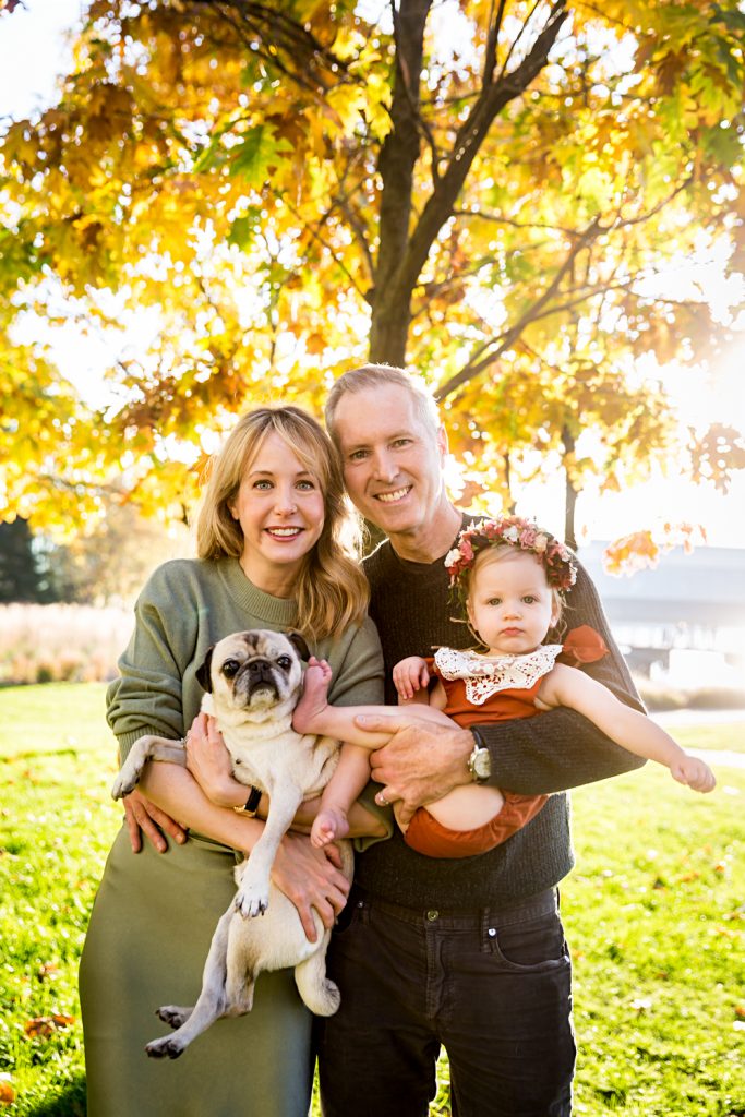 Family under golden trees for an article NYC golden hour portrait tips