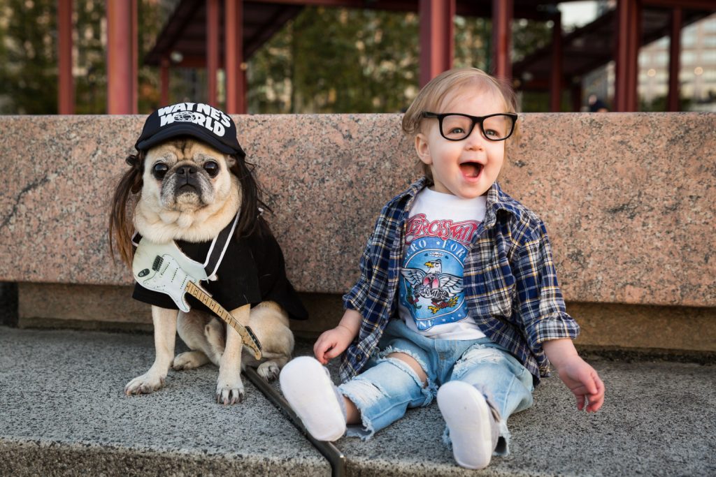 Little girl and dog dressed in Wayne's World Halloween costume