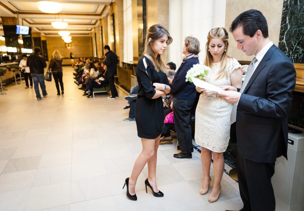 Waiting for a Manhattan Marriage Bureau wedding to take place, by NYC wedding photojournalist, Kelly Williams