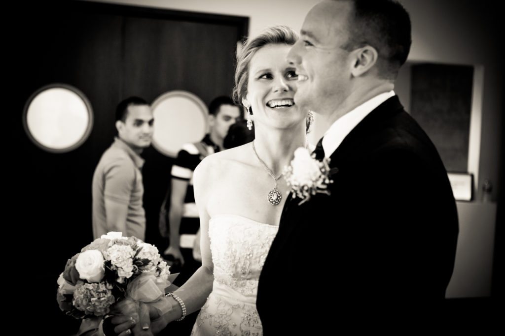 Bride and groom waiting for their NYC City Hall wedding, by Kelly Williams