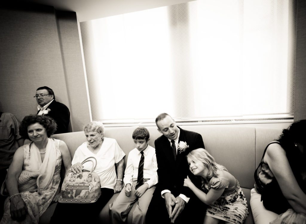 Guests waiting for a NYC City Hall wedding, by Kelly Williams