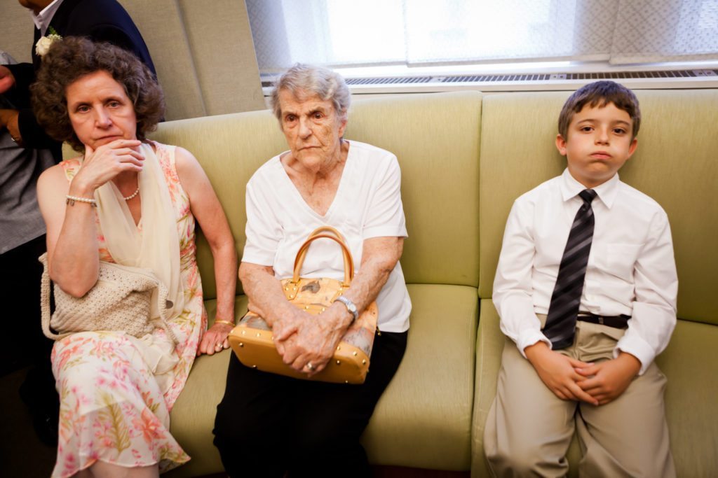 Guests waiting for a NYC City Hall wedding, by Kelly Williams