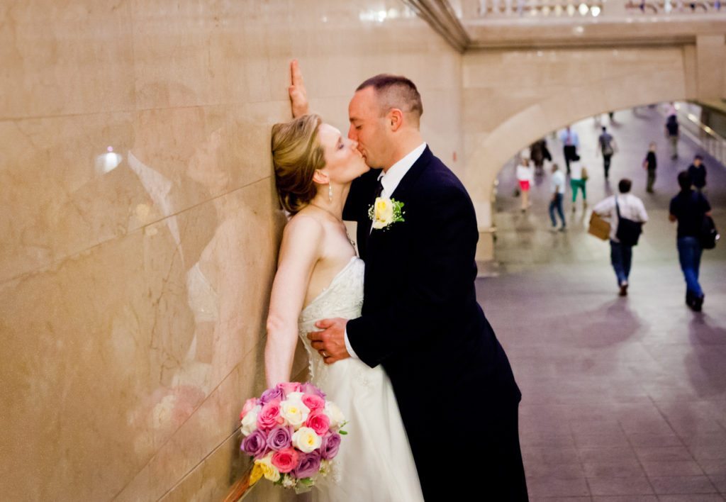 Bride and groom portrait in Grand Central after a NYC City Hall wedding, by Kelly Williams