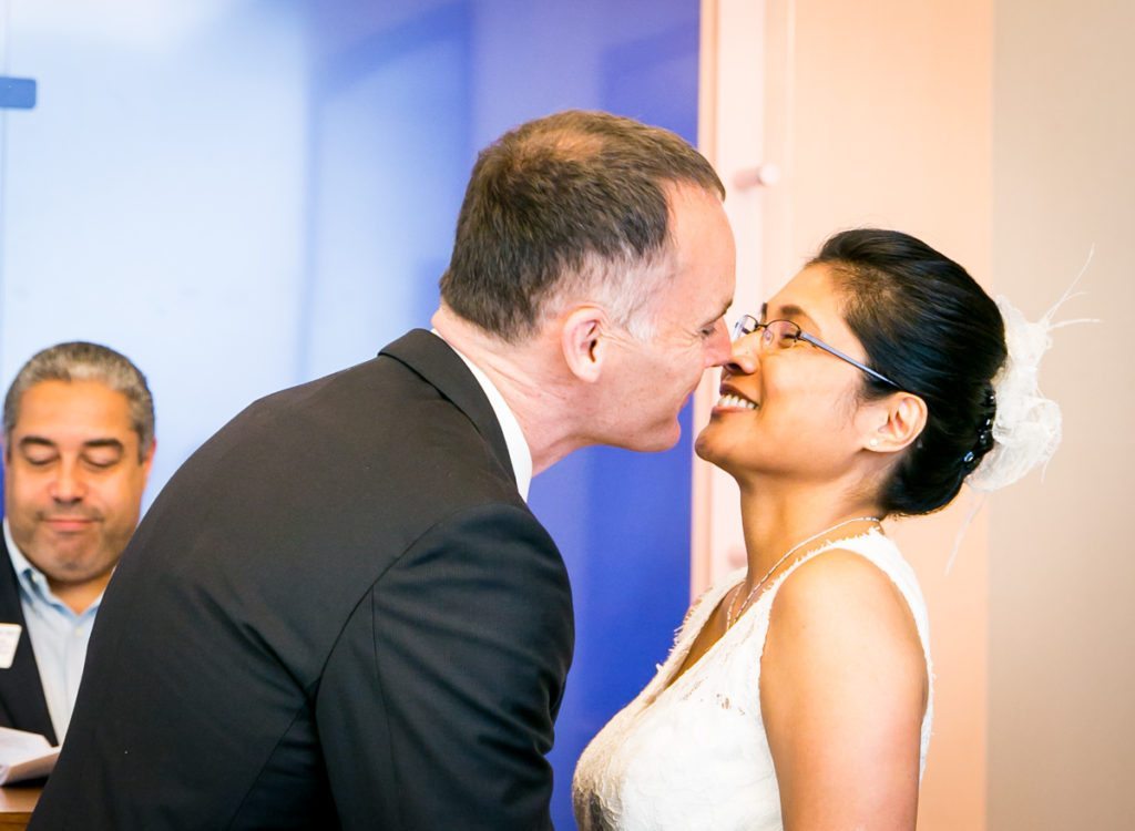 A couple kissing, by NYC City Hall wedding photographer, Kelly Williams