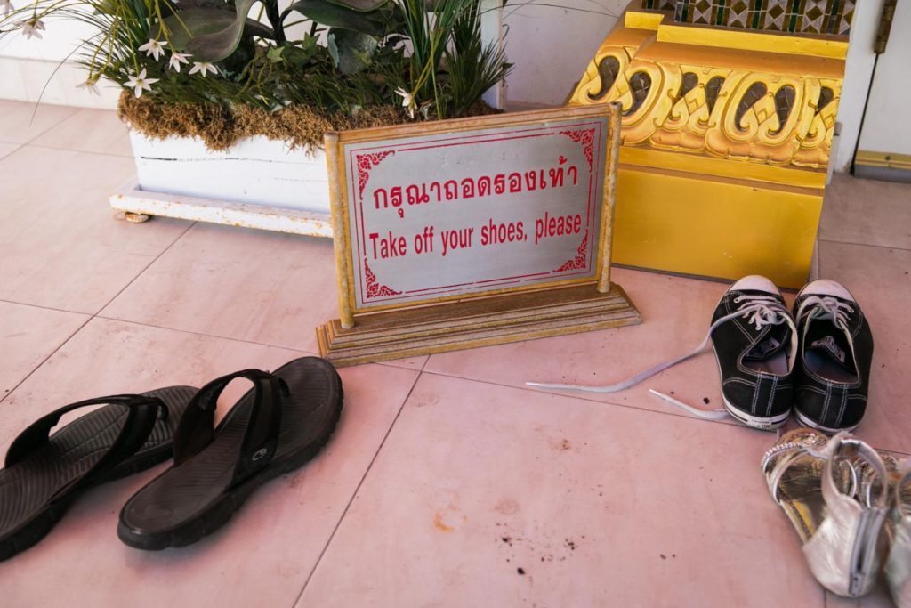 No shoes allowed in the Wat Mongkolratanaram, photographed by NYC photojournalist, Kelly Williams