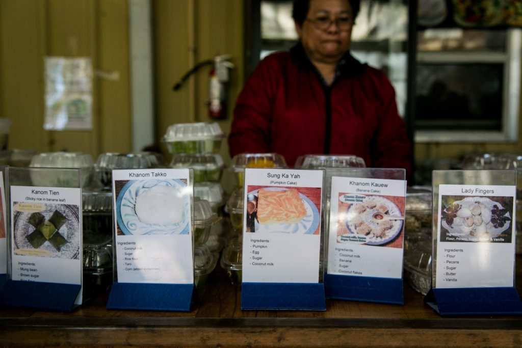 Today's menu items at the Asian food market of the Wat Mongkolratanaram, photographed by NYC photojournalist, Kelly Williams