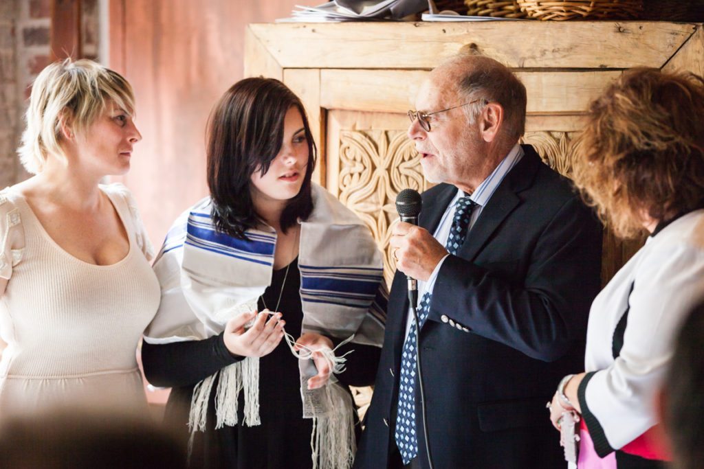 Grandparents making a toast, by NYC bat mitzvah photographer, Kelly Williams
