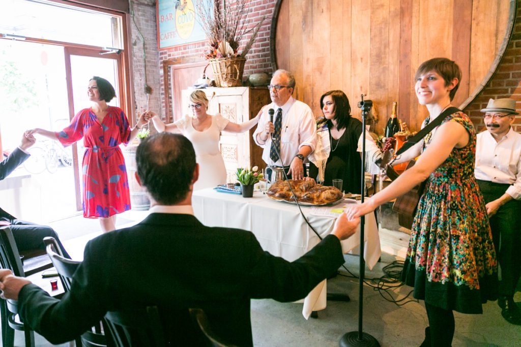 Blessing the challah, by NYC bat mitzvah photographer, Kelly Williams