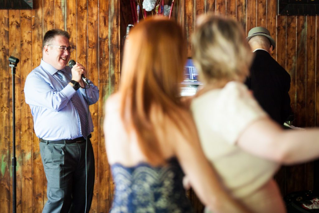 A karaoke performance, by NYC bat mitzvah photographer, Kelly Williams