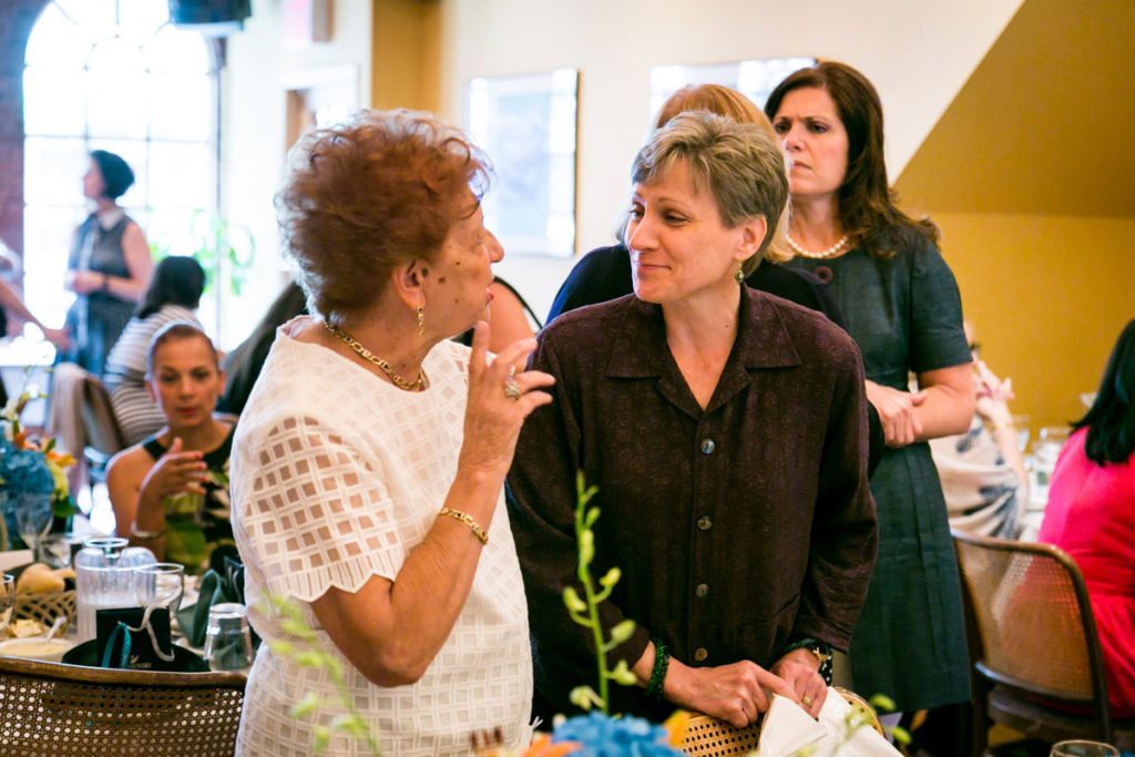 Guests mingling at  the bridal shower by Bay Ridge bridal shower photographer, Kelly Williams