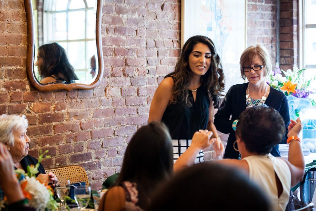 The bride  mingling at  her shower by Bay Ridge bridal shower photographer, Kelly Williams