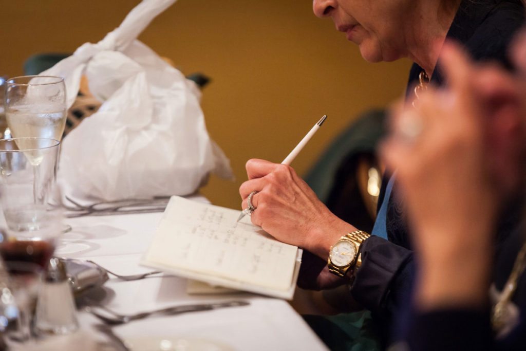 Signing the guest book by Bay Ridge wedding photographer, Kelly Williams