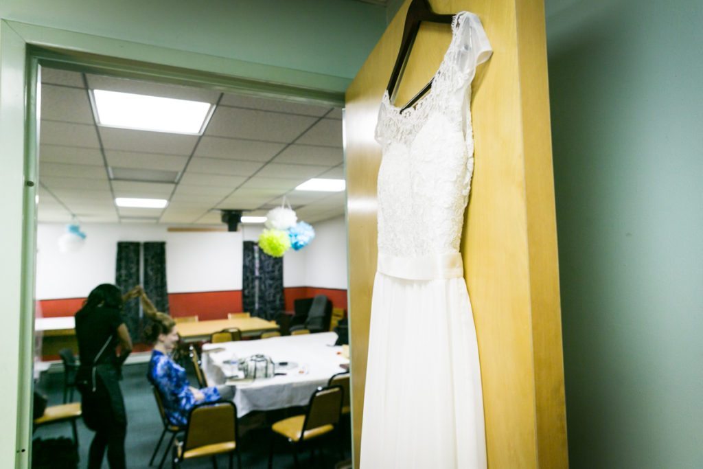 A bride getting ready, by Douglaston Manor wedding photographer, Kelly Williams