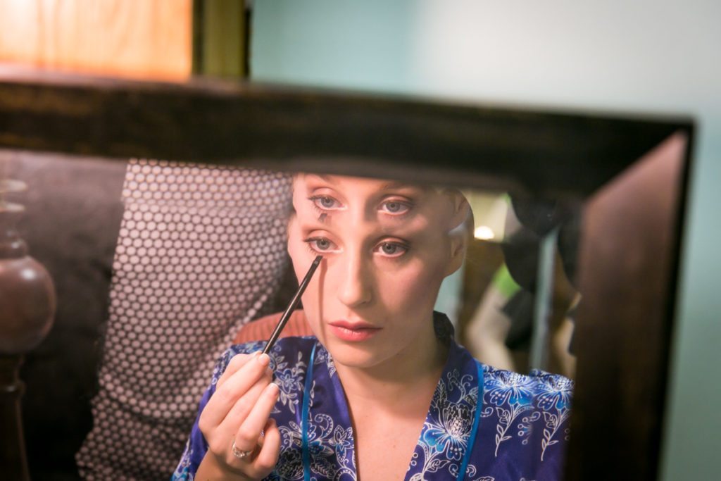 A bride getting ready, by Douglaston Manor wedding photographer, Kelly Williams