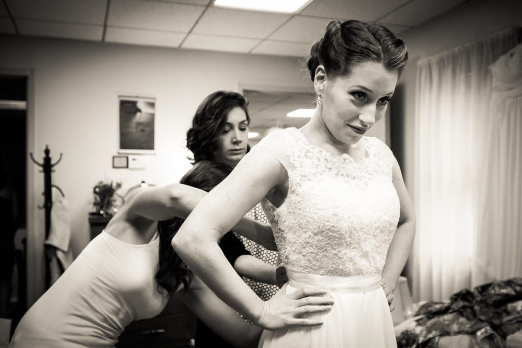 A bride getting ready, by Douglaston Manor wedding photographer, Kelly Williams
