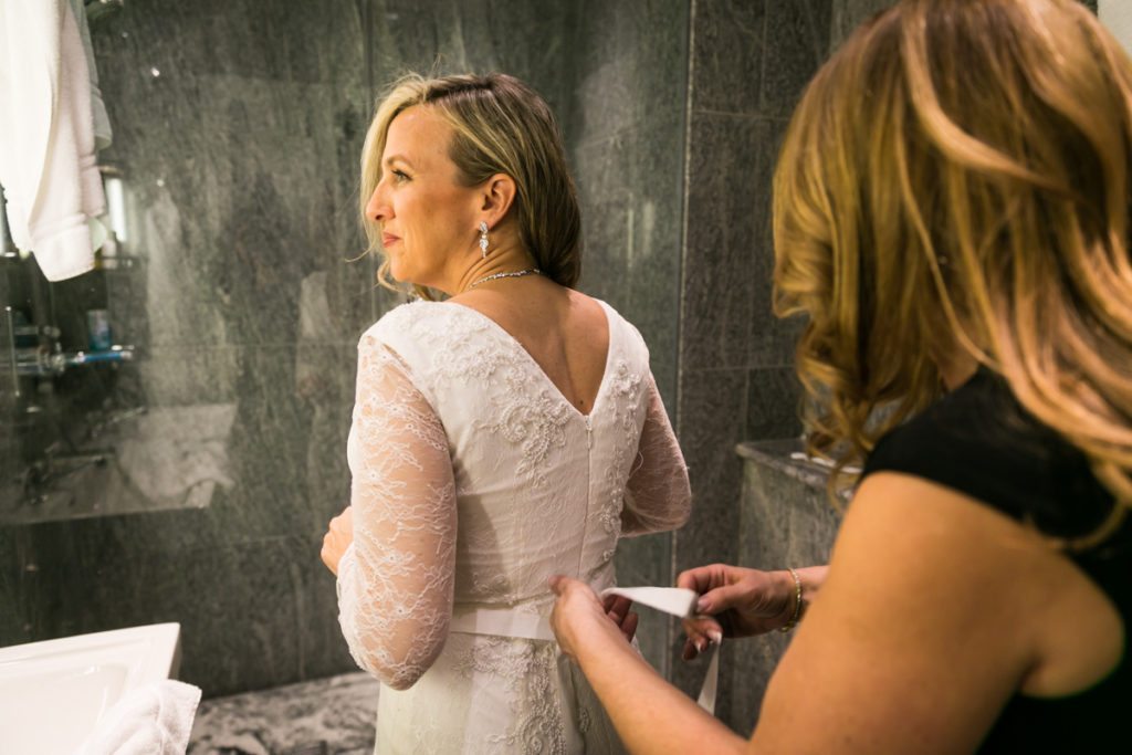The bride getting ready before a Housing Works Bookstore wedding, by NYC wedding photojournalist, Kelly Williams