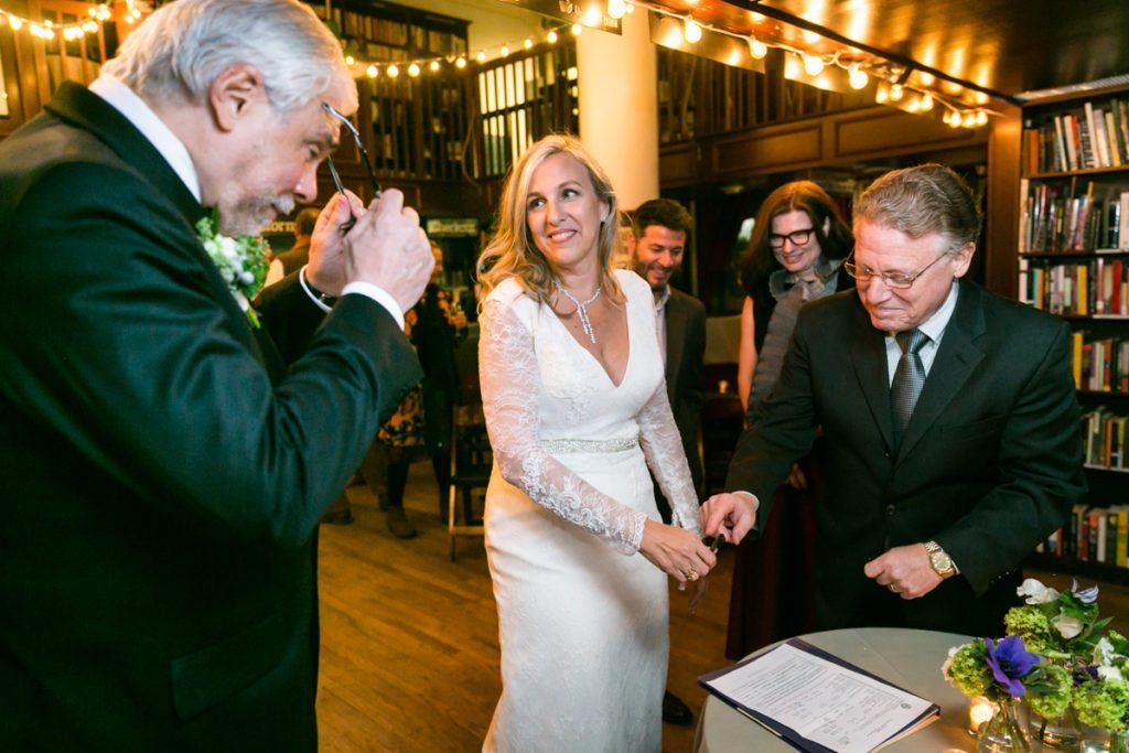 Moments before a Housing Works Bookstore wedding, by NYC wedding photojournalist, Kelly Williams