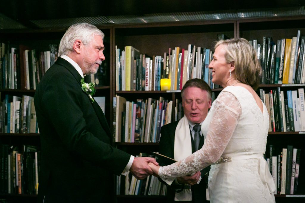 Ceremony photos from a Housing Works Bookstore wedding, by NYC wedding photojournalist, Kelly Williams