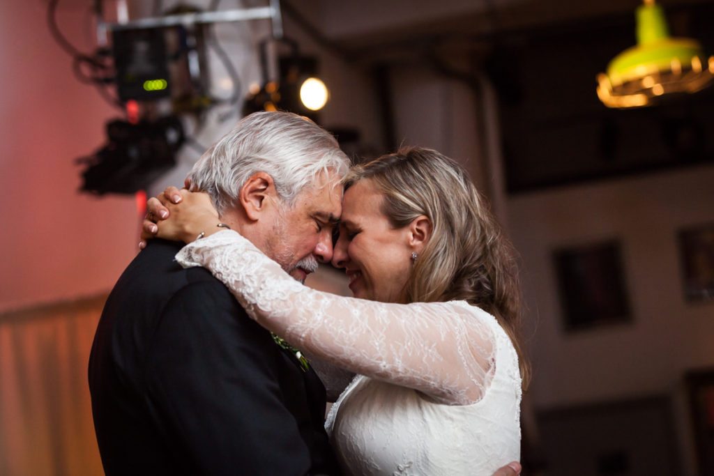 Portrait of the bride and groom at a Housing Works Bookstore wedding, by NYC wedding photojournalist, Kelly Williams