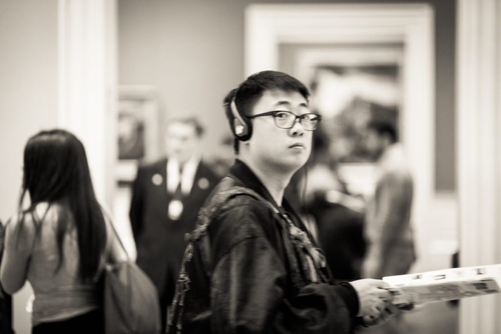 Candid shot of a museum goer at the Metropolitan Museum of Art, by NYC street photographer, Kelly Williams