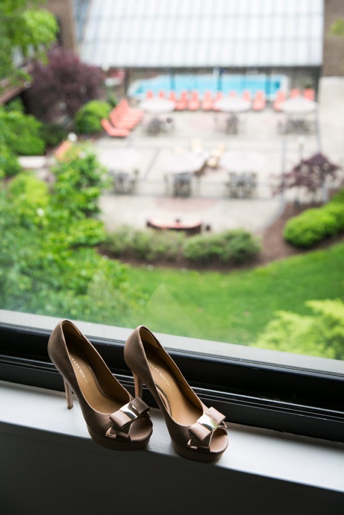 A bride's heels in a window