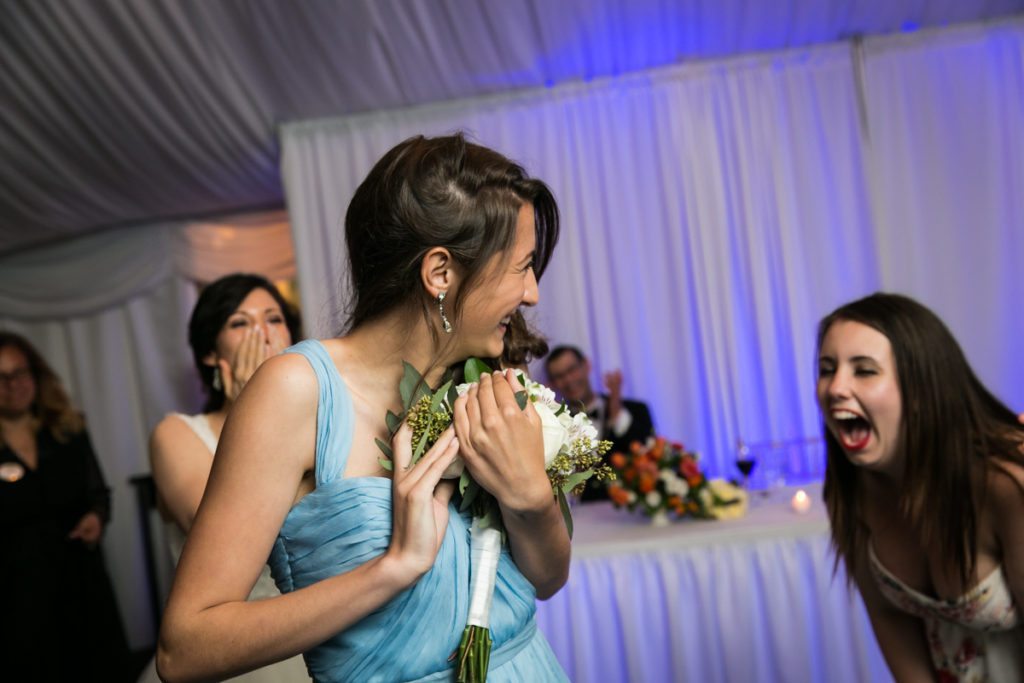 Bouquet toss at a Pelham Bay & Split Rock Golf Club wedding reception