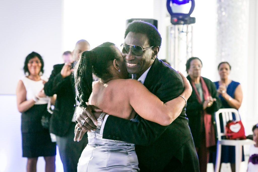 Hugging at an Allegria Hotel party by NYC event photojournalist, Kelly Williams