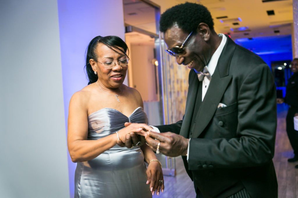 Ring exchange at an Allegria Hotel party by NYC event photojournalist, Kelly Williams