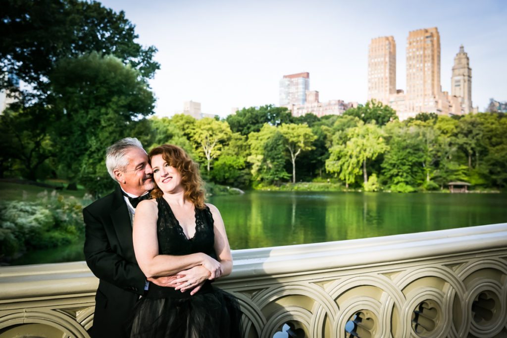 Couple at the Bow Bridge for an article on Central Park engagement shoot tips by NYC engagement photographer, Kelly Williams