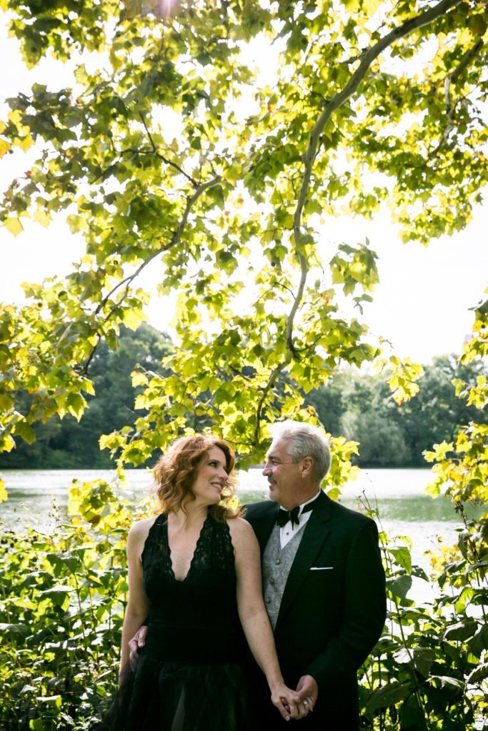 Couple posed for an article on Central Park engagement shoot tips by NYC engagement photographer, Kelly Williams