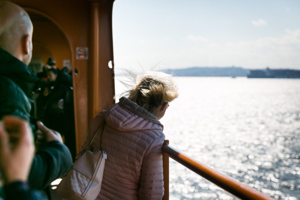 Tourists on the Staten Island Ferry, by NYC photographer, Kelly Williams