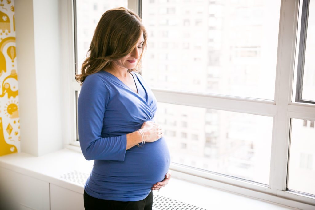 Manhattan mother-to-be by photojournalistic maternity photographer, Kelly Williams