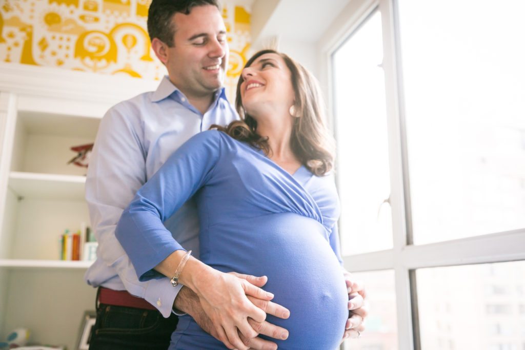 Manhattan parents-to-be by photojournalistic maternity photographer, Kelly Williams