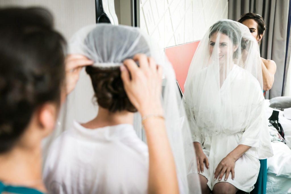 Bride getting ready for a Columbus Citizens Foundation wedding by NYC wedding photojournalist, Kelly Williams