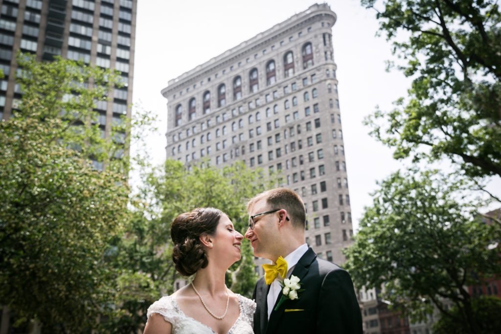 Bride and groom portrait in Madison Square Park for a Columbus Citizens Foundation wedding by NYC wedding photojournalist, Kelly Williams