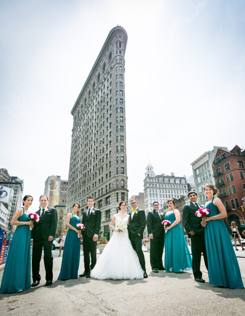 Bridal party at the Flatiron Building before a Columbus Citizens Foundation wedding by NYC wedding photojournalist, Kelly Williams