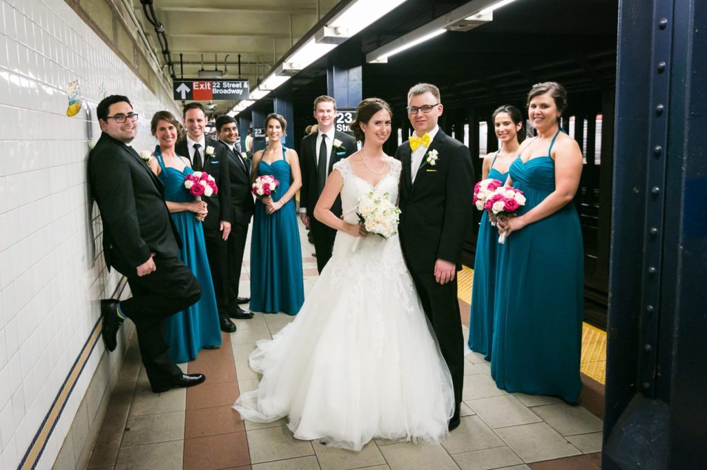 Bridal party in the NYC subway before a Columbus Citizens Foundation wedding by NYC wedding photojournalist, Kelly Williams