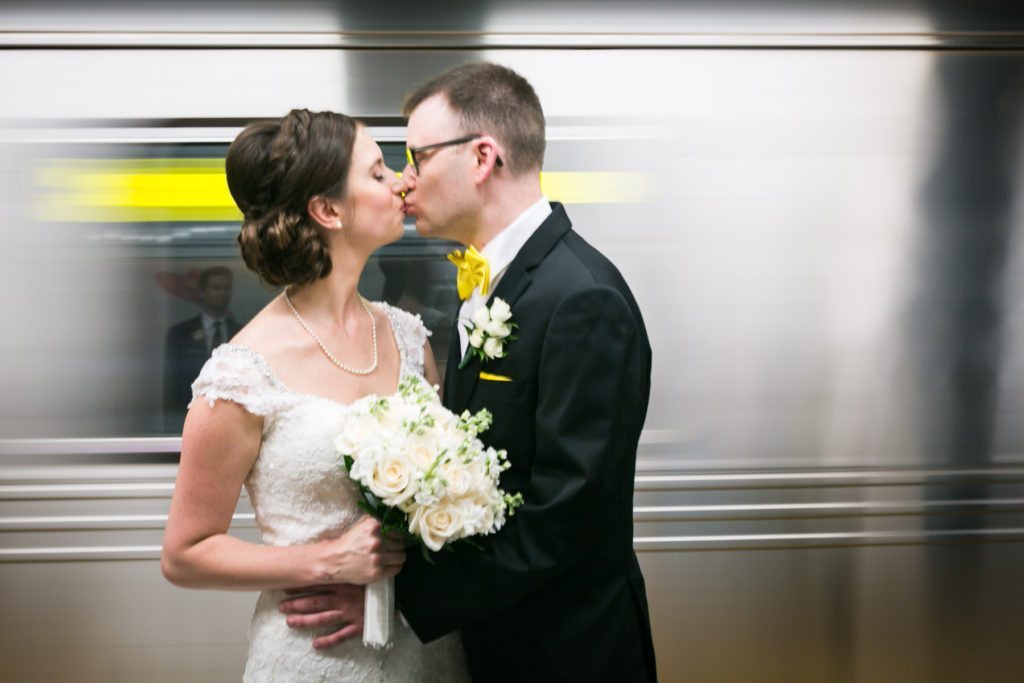 Bride and groom in the NYC subway before a Columbus Citizens Foundation wedding by NYC wedding photojournalist, Kelly Williams