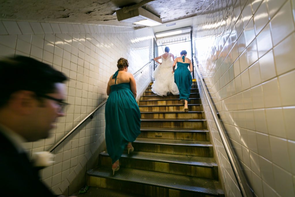 Bridal party in the NYC subway before a Columbus Citizens Foundation wedding by NYC wedding photojournalist, Kelly Williams