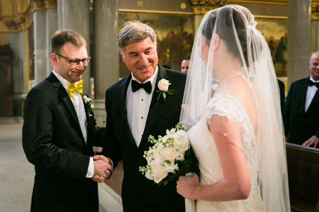 Ceremony at the Church of St. Francis Xavier before a Columbus Citizens Foundation wedding by NYC wedding photojournalist, Kelly Williams