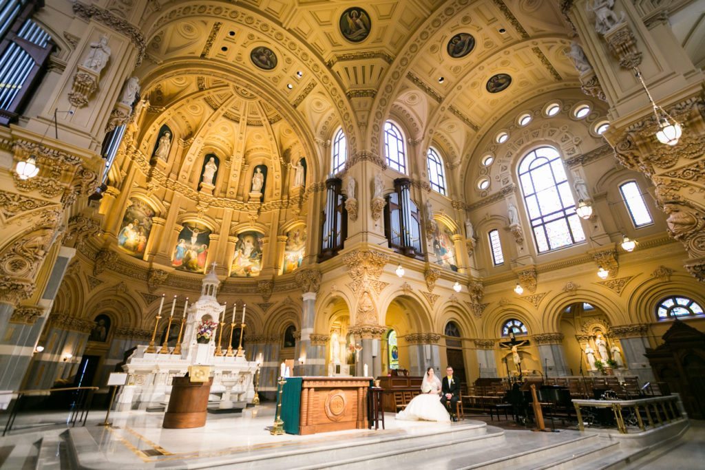 Ceremony at the Church of St. Francis Xavier before a Columbus Citizens Foundation wedding by NYC wedding photojournalist, Kelly Williams