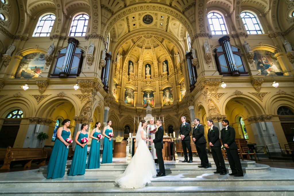 Ceremony at the Church of St. Francis Xavier before a Columbus Citizens Foundation wedding by NYC wedding photojournalist, Kelly Williams