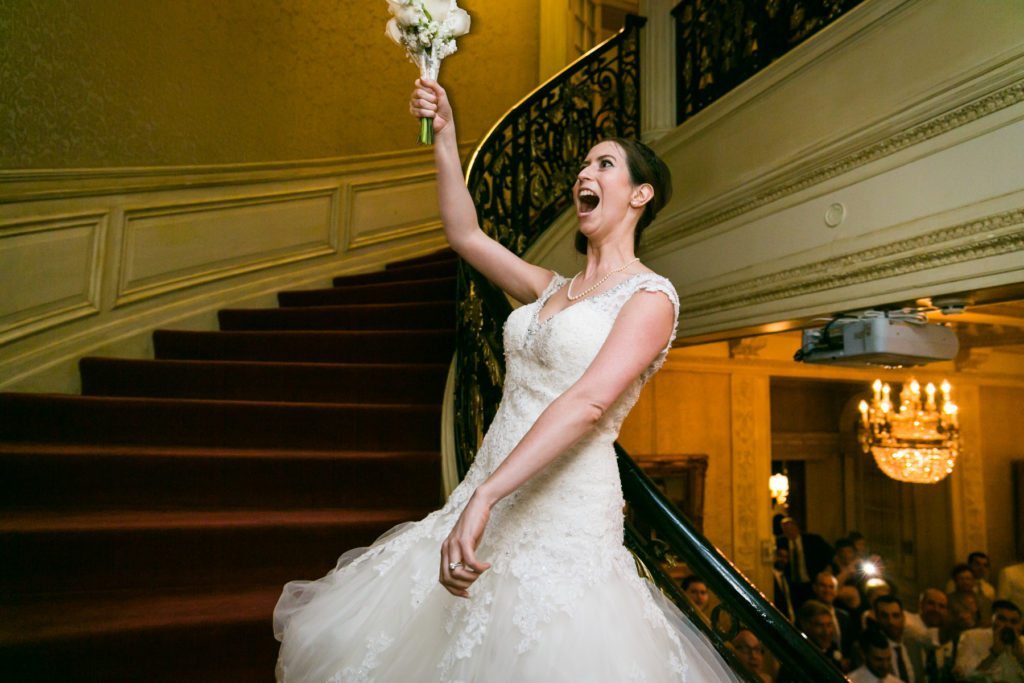 Bouquet toss at a Columbus Citizens Foundation wedding by NYC wedding photojournalist, Kelly Williams