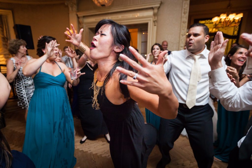 Guest dancing at a Columbus Citizens Foundation wedding by NYC wedding photojournalist, Kelly Williams