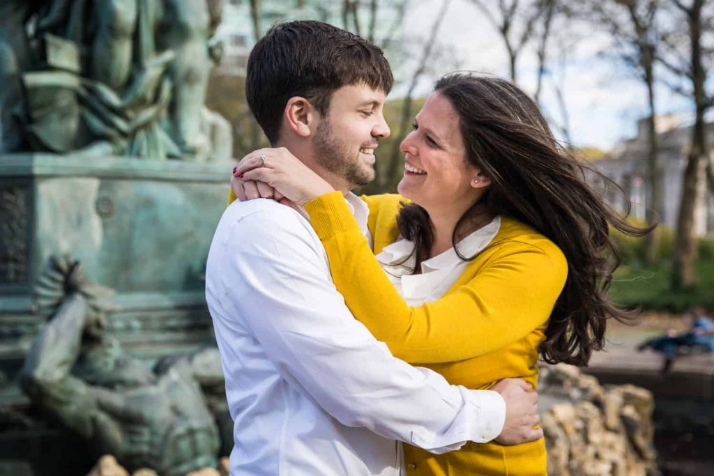 Grand Army Plaza engagement photos of couple hugging