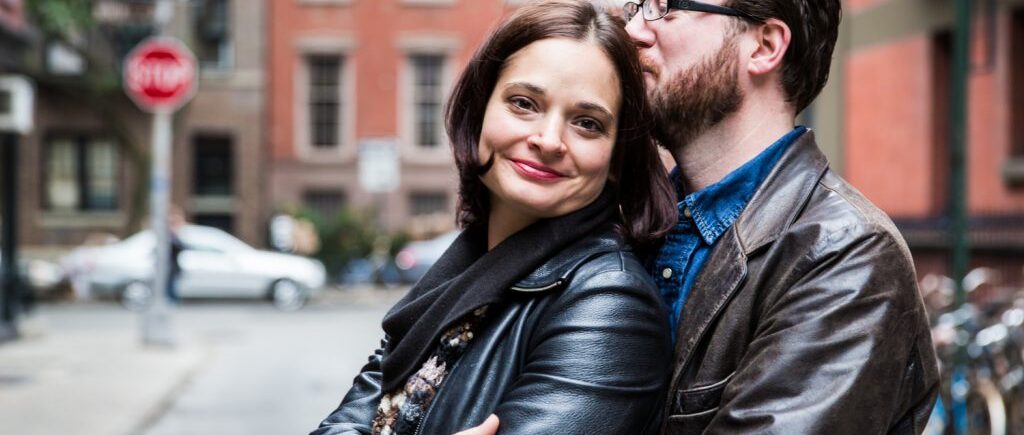 Couple hugging in middle of street during a Greenwich Village engagement session